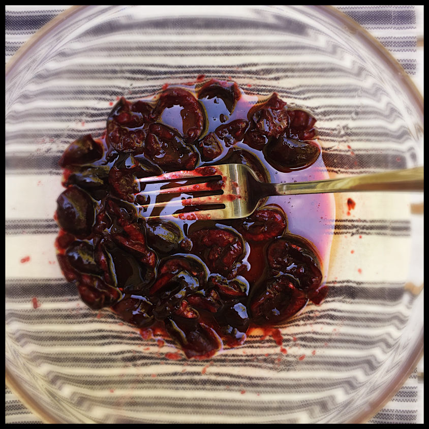 picture of smashed cherries in a glass bowl