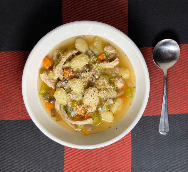 Photo of bowl of soup and spoon