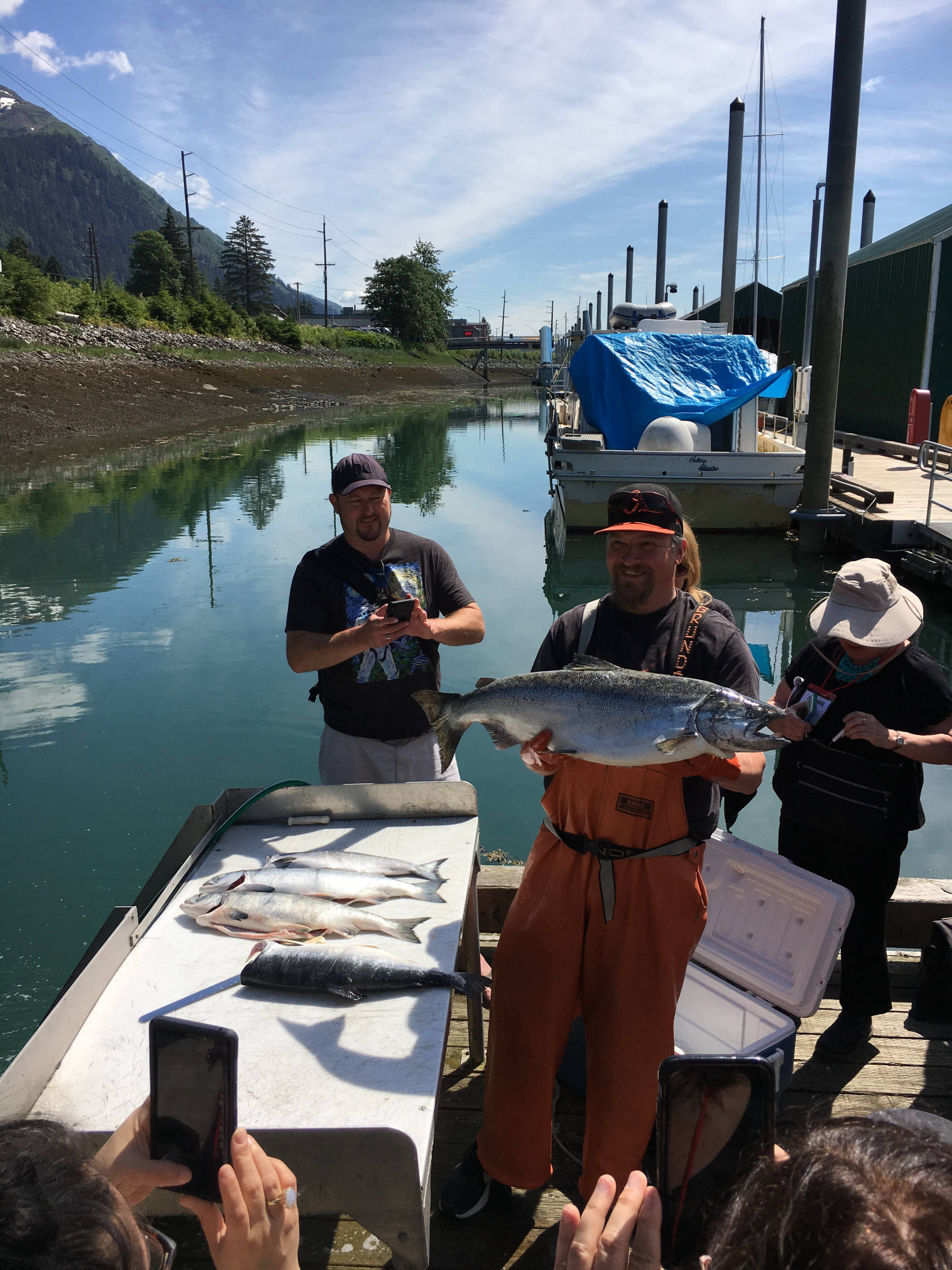 Fisherman holding salmon
